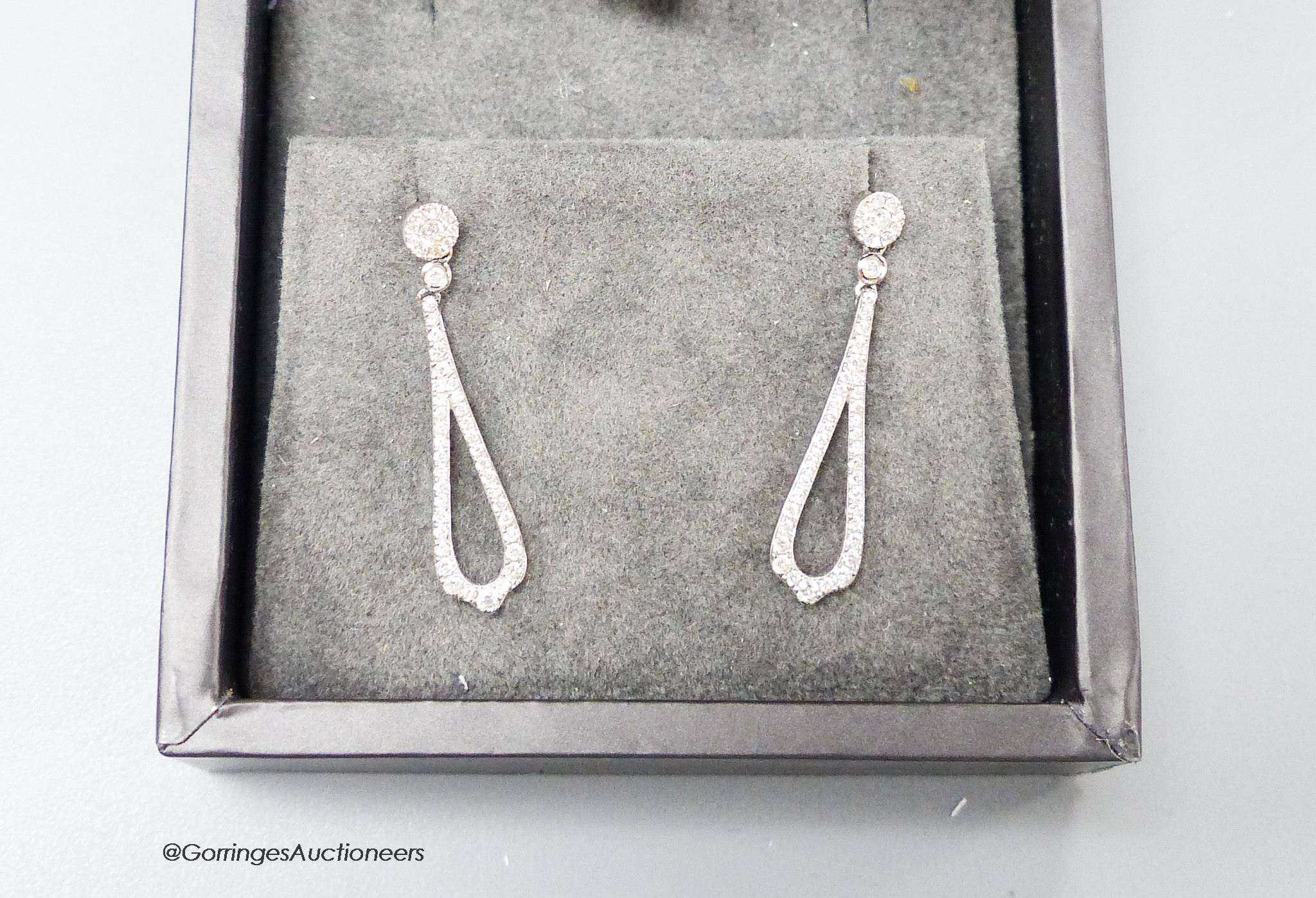 A modern pair of Rox 18ct white gold and diamond cluster set teardrop shaped loop drop earrings, 27mm, gross weight 2.2 grams.